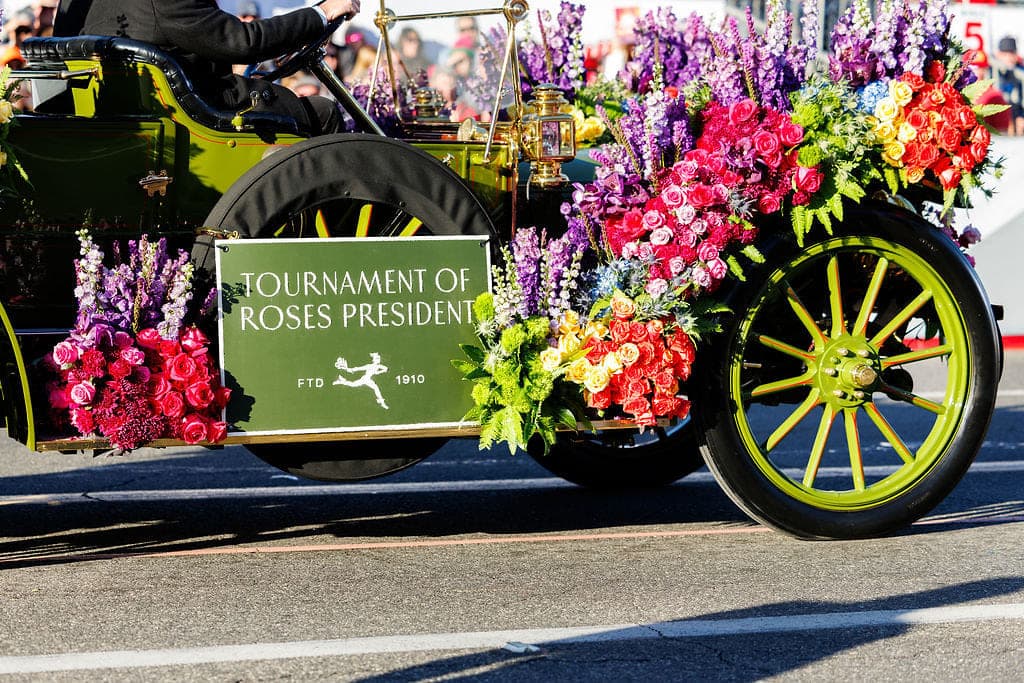Roses, delphinium and stock wrapping the Tournament of Roses President's car